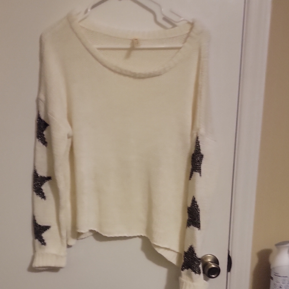 Cream Sweater with Black Star Sleeves